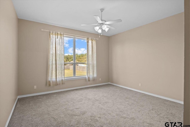 carpeted empty room with ceiling fan