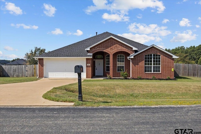 ranch-style home with a garage and a front yard