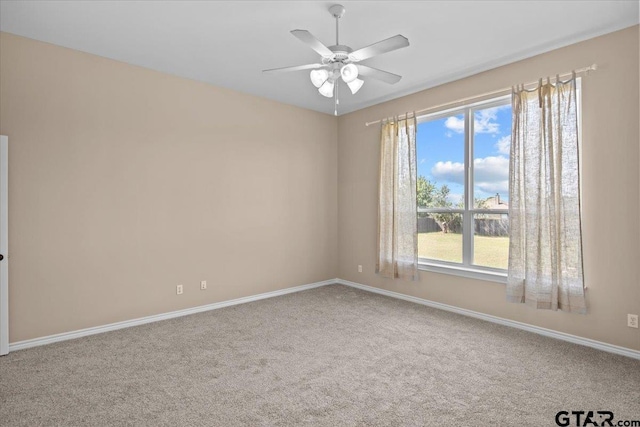 unfurnished room with carpet and ceiling fan