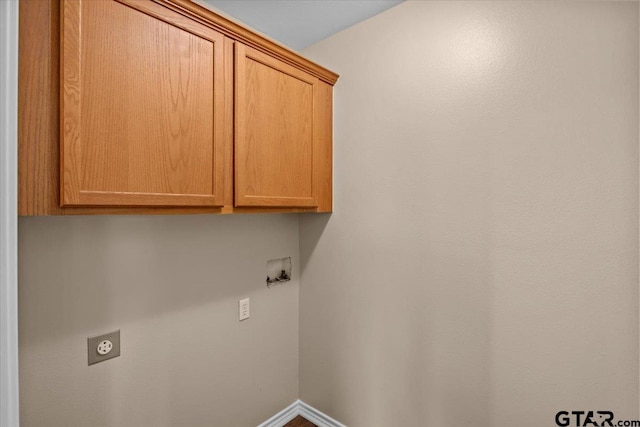 washroom featuring electric dryer hookup, cabinets, and hookup for a washing machine