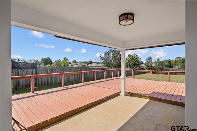 wooden terrace featuring a yard