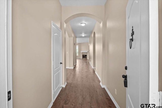 corridor featuring dark hardwood / wood-style flooring