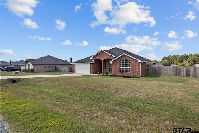 ranch-style home featuring a front lawn and a garage