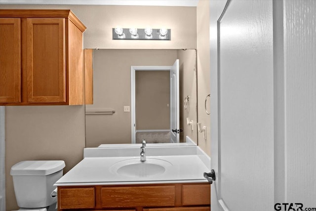 bathroom with vanity and toilet