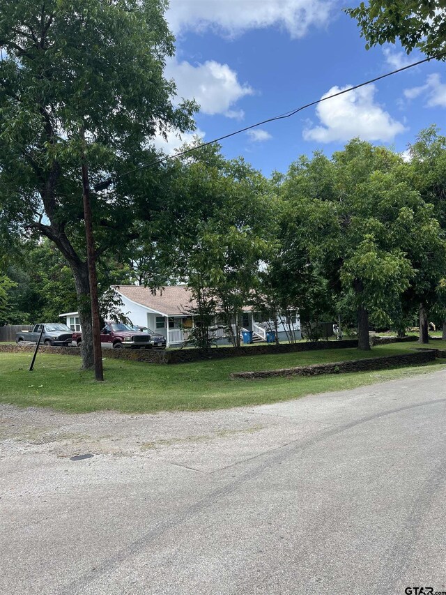 113 W Paschal St, Troup, TX 75789 - view of front of home with a front lawn