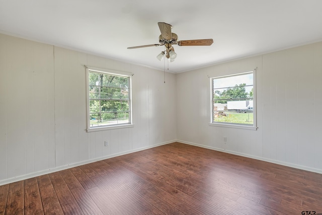 559 Elm St, Frankston, TX 75763 - spare room with hardwood / wood-style flooring, healthy amount of natural light, ceiling fan, ornamental molding, and baseboards