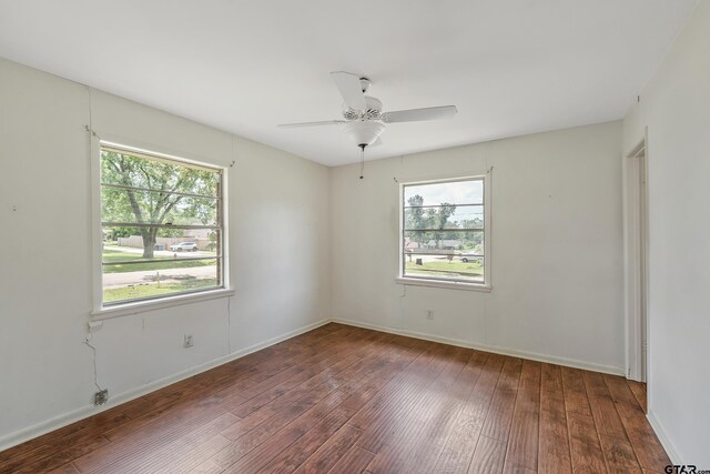 559 Elm St, Frankston, TX 75763 - empty room featuring hardwood / wood-style floors, healthy amount of natural light, a ceiling fan, and baseboards
