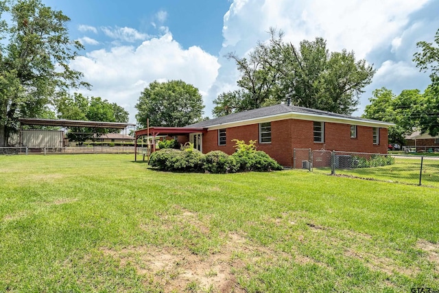 559 Elm St, Frankston, TX 75763 - back of property with brick siding and a carport