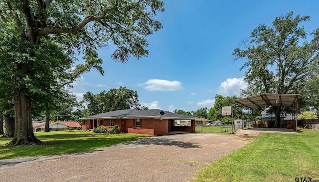 559 Elm St, Frankston, TX 75763 - view of side of home with concrete driveway and a carport