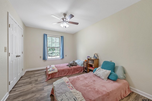 3466 County Road 4305, Larue, TX 75770 - bedroom featuring baseboards, wood finished floors, and ceiling fan