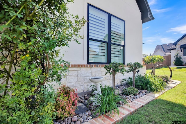 view of property exterior featuring a yard