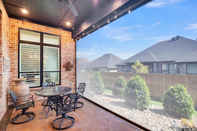 exterior space featuring ceiling fan