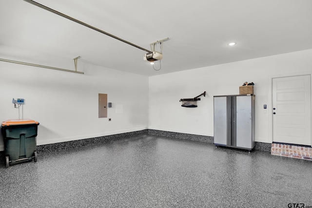 garage featuring a garage door opener and electric panel