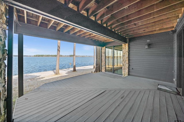 deck featuring a water view and a boat dock