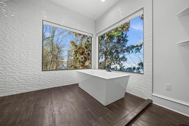 unfurnished office featuring wood tiled floor