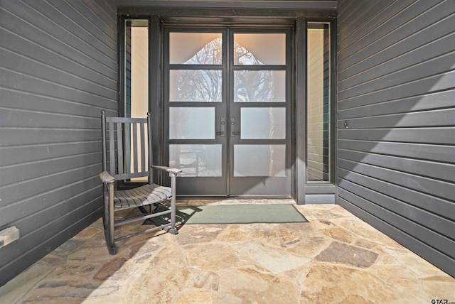 property entrance featuring french doors