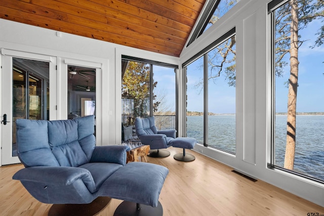 sunroom / solarium featuring wooden ceiling, vaulted ceiling, a water view, and visible vents