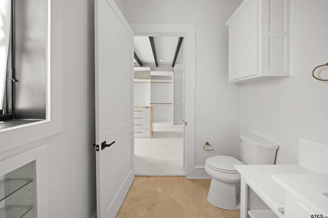 bathroom featuring tile patterned flooring and toilet