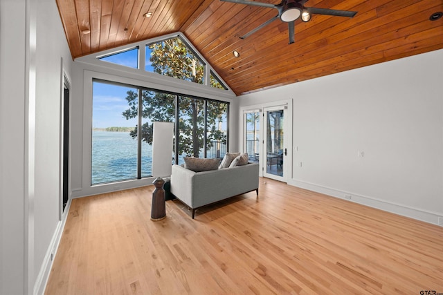 living area with wood ceiling, a water view, light wood-style flooring, and baseboards