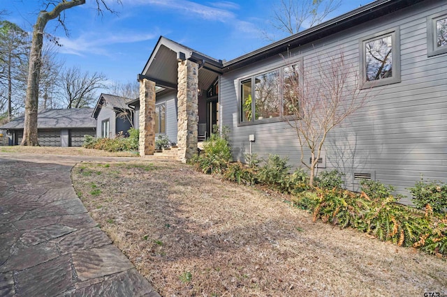 view of side of property with crawl space