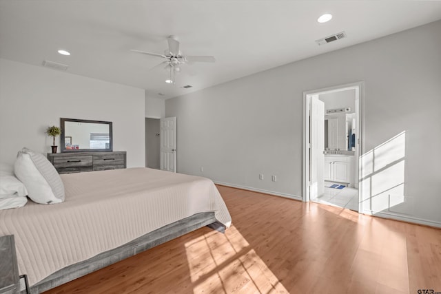 bedroom with visible vents, recessed lighting, baseboards, and wood finished floors