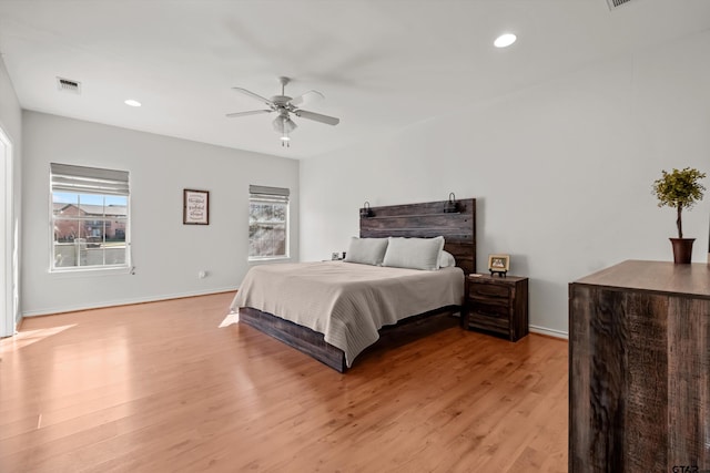 bedroom with recessed lighting, visible vents, baseboards, and light wood-style floors