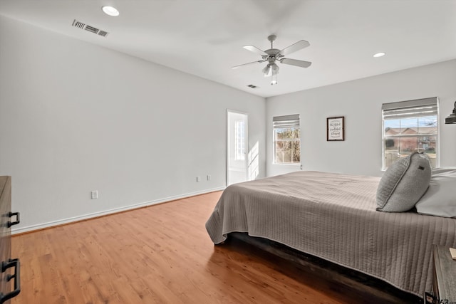 bedroom with visible vents, a ceiling fan, wood finished floors, recessed lighting, and baseboards