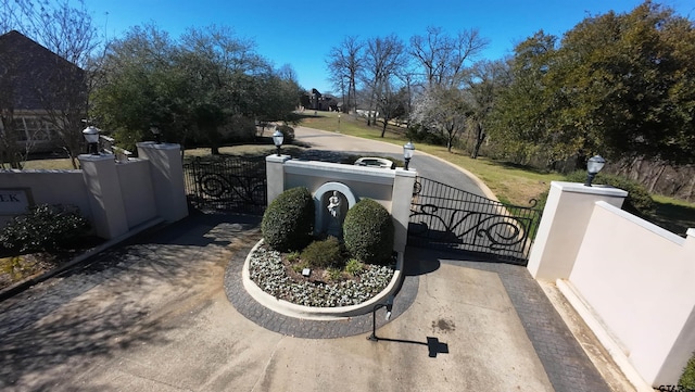 exterior details with a fenced front yard and a gate