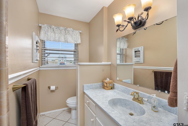 311 E Amherst St, Tyler, TX 75703 - bathroom with a chandelier, tile patterned flooring, vanity, toilet, and baseboards