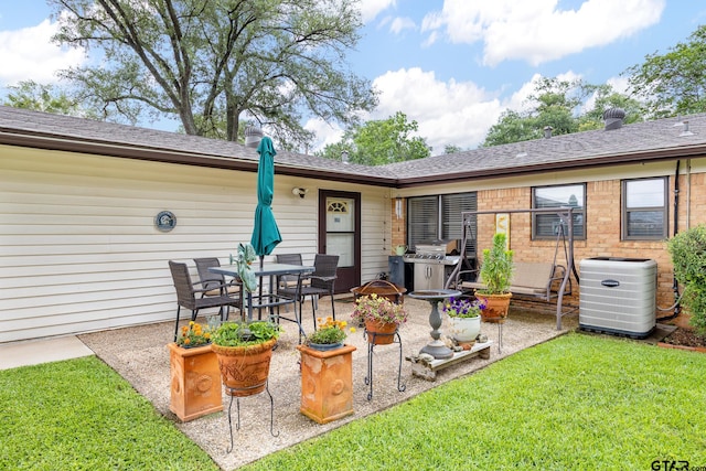 311 E Amherst St, Tyler, TX 75703 - back of property with cooling unit, a patio, a lawn, and a shingled roof