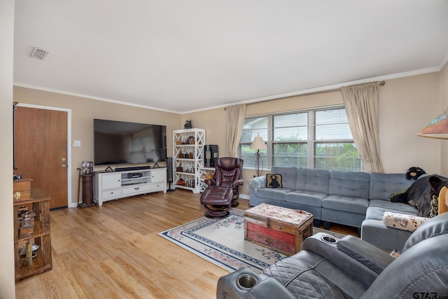 311 E Amherst St, Tyler, TX 75703 - living room featuring wood finished floors, ornamental molding, and baseboards