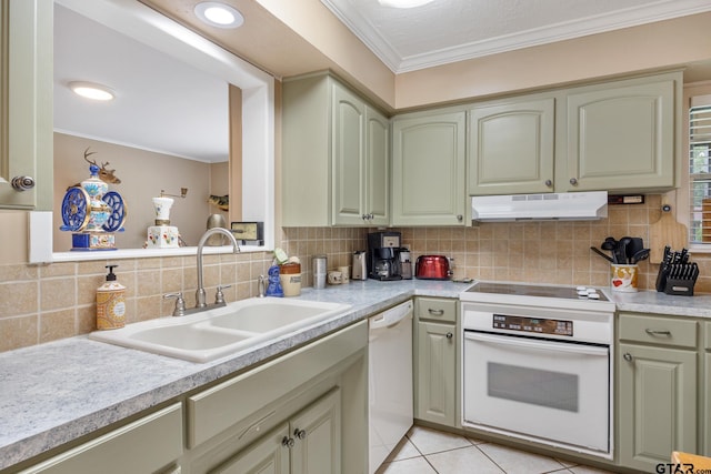 311 E Amherst St, Tyler, TX 75703 - kitchen featuring under cabinet range hood, white appliances, a sink, ornamental molding, and light countertops
