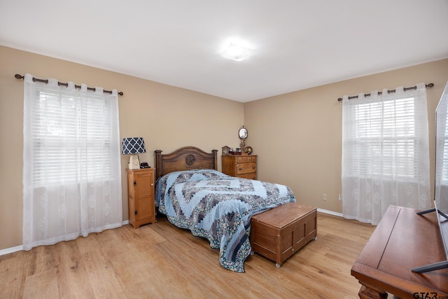 311 E Amherst St, Tyler, TX 75703 - bedroom featuring light wood-type flooring and baseboards