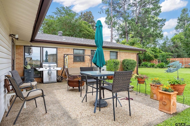 311 E Amherst St, Tyler, TX 75703 - view of patio featuring grilling area and outdoor dining space