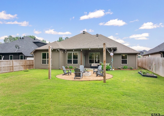 19128 Ambrosia Dr, Flint, TX 75762 - back of property with an outdoor fire pit, roof with shingles, and a patio area