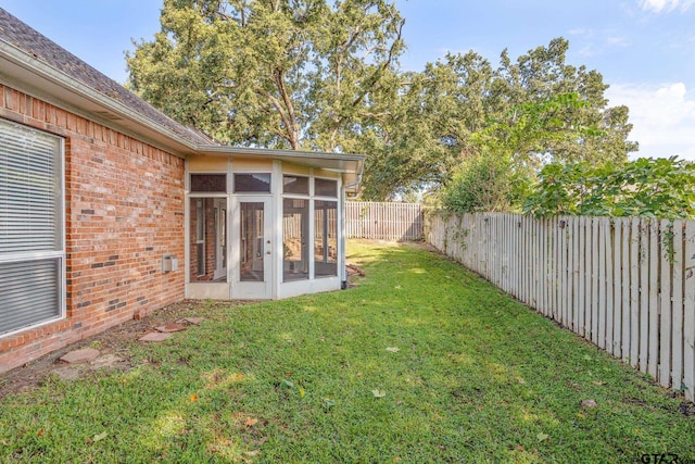 view of yard featuring a sunroom