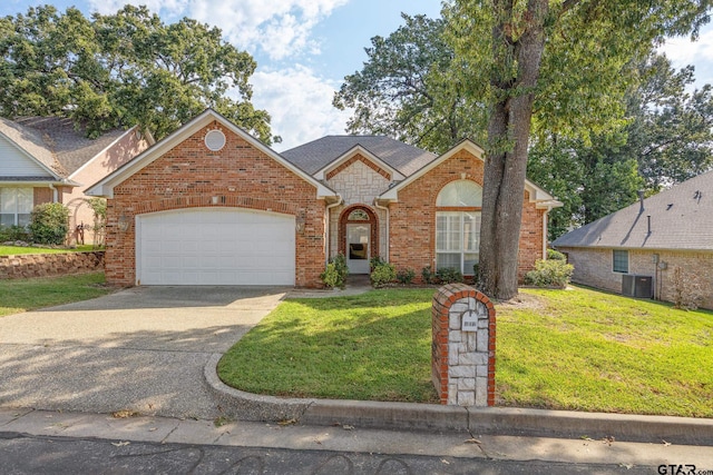 front facade featuring central AC unit, a garage, and a front yard