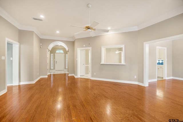 unfurnished living room with light hardwood / wood-style floors, ceiling fan, and ornamental molding