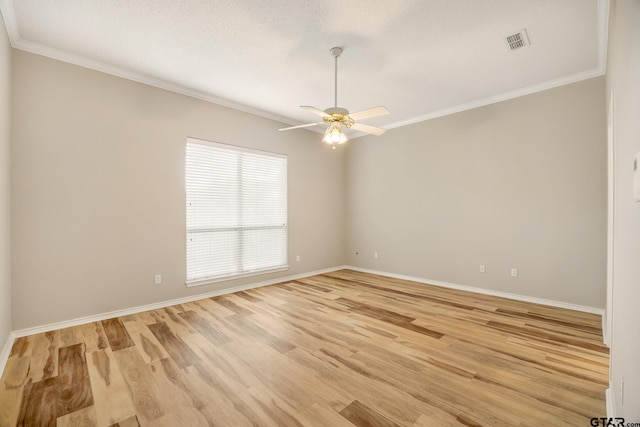 unfurnished room featuring ornamental molding, a textured ceiling, ceiling fan, and light hardwood / wood-style flooring