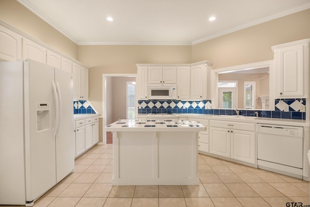 kitchen with white cabinets, white appliances, light tile patterned flooring, and ornamental molding