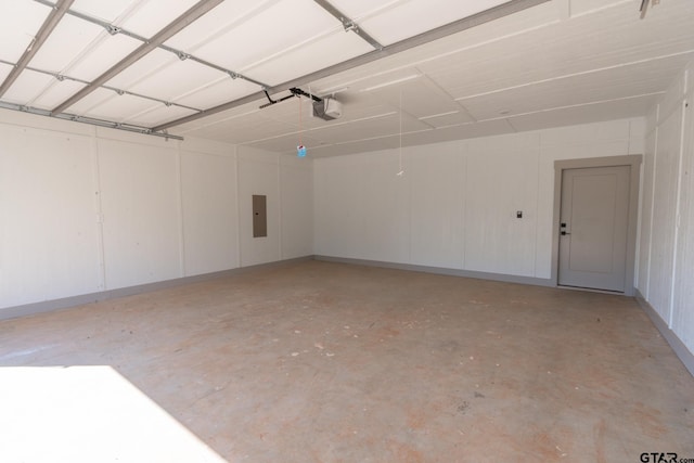 garage featuring a garage door opener and electric panel