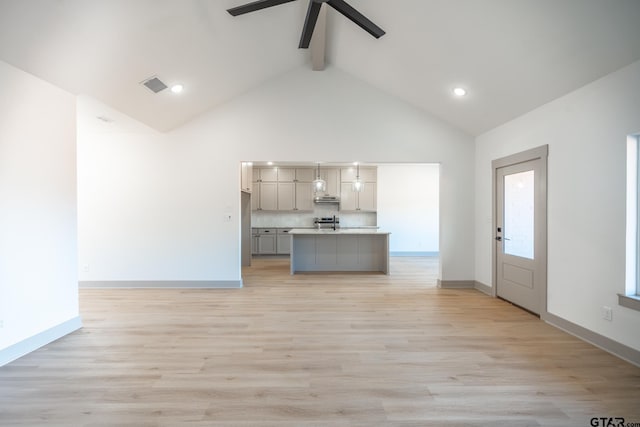 unfurnished living room with high vaulted ceiling, light wood-type flooring, ceiling fan, and beam ceiling