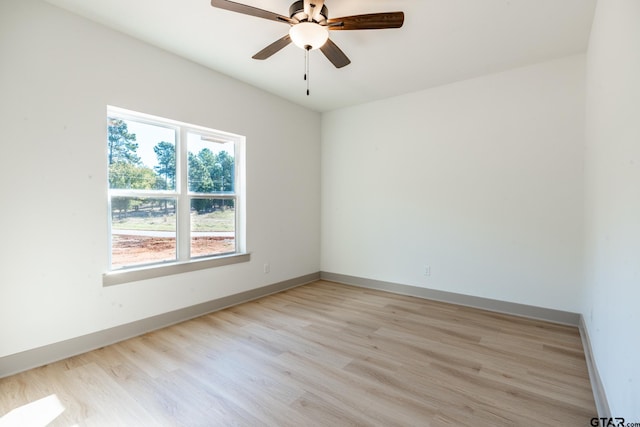 unfurnished room with light wood-type flooring and ceiling fan