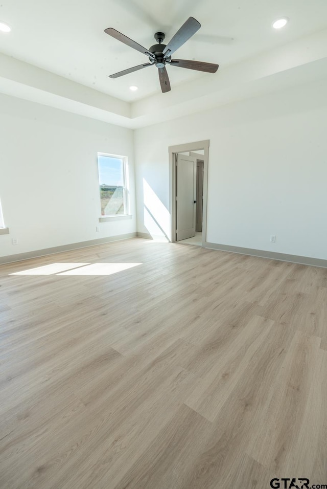 unfurnished room featuring ceiling fan and light wood-type flooring