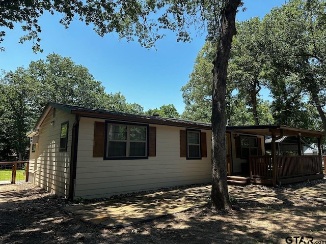 view of home's exterior with a deck