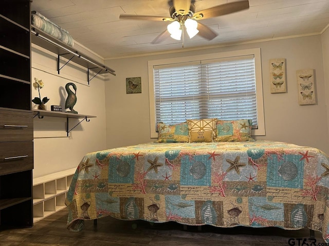 bedroom with ceiling fan, crown molding, and dark hardwood / wood-style floors