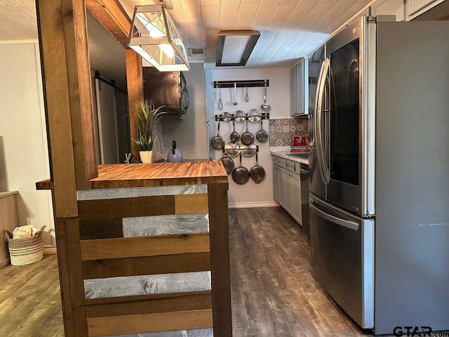 kitchen featuring appliances with stainless steel finishes, wooden ceiling, and dark hardwood / wood-style flooring