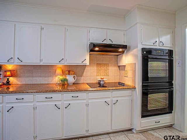 kitchen featuring dark stone counters, black appliances, white cabinets, crown molding, and tasteful backsplash