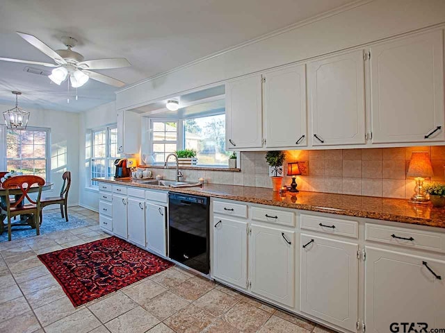 704 Wellington St, Tyler, TX 75703 - kitchen featuring dishwasher, backsplash, white cabinets, ceiling fan, and a chandelier