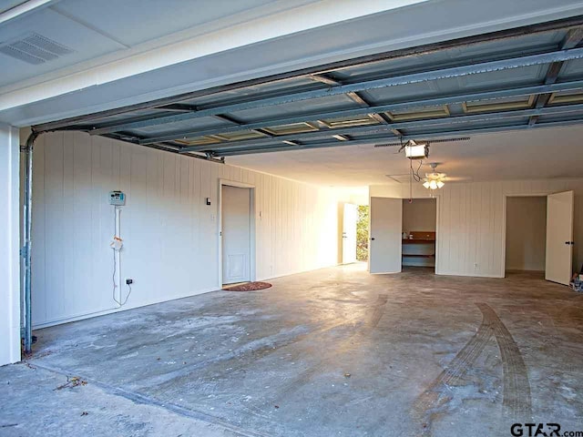 garage featuring a garage door opener and ceiling fan